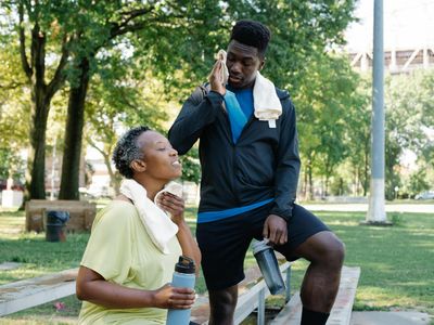 Water bottle and towel on a dark bench in studio